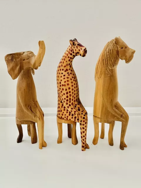 3 Vintage Pre-owned Hand Carved Hand  Painted African Animal Sitting On A Stool.