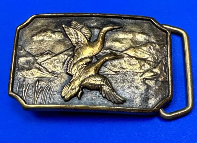 Two ducks flying from pond cat tails Nature Solid Brass belt buckle by BTS