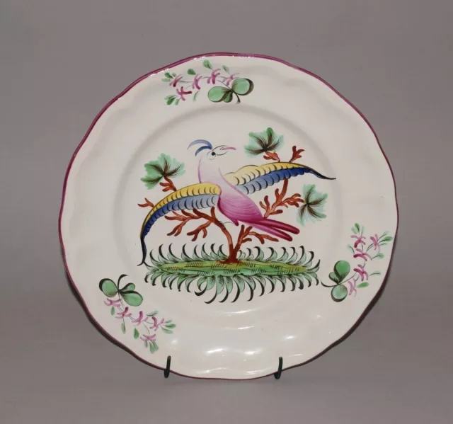 Assiette en faïence de St Clément  - décor d' oiseau