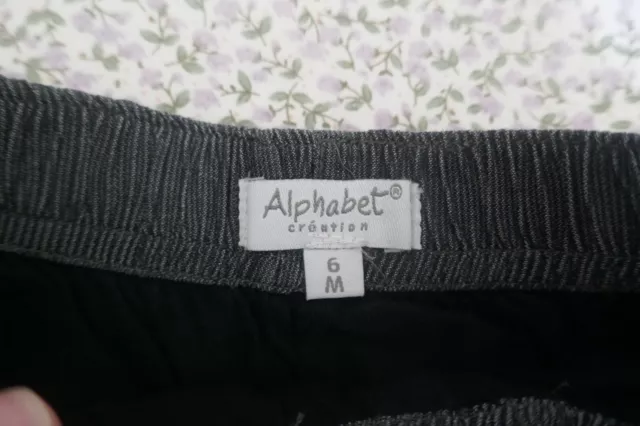 Short noir (100% coton) T. 6 mois ALPHABET 2