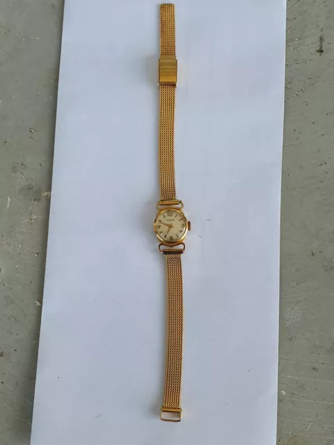 MONTRE FEMME MECANIQUE Universal Geneve En Or 18 K 2 Poin ons Tete