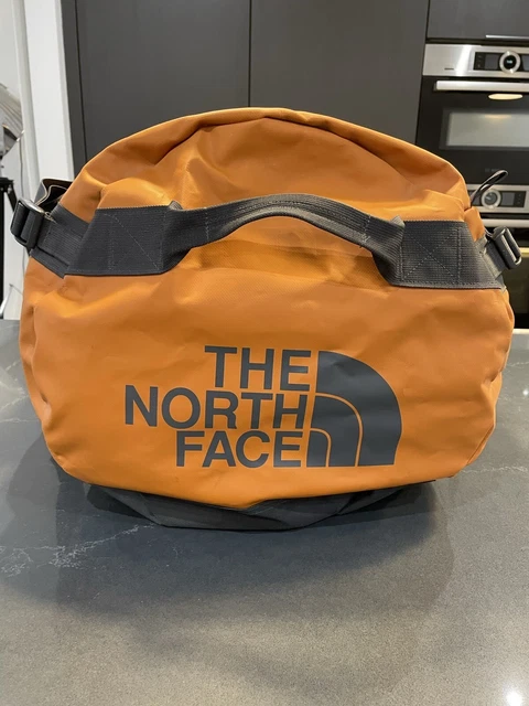 The  North Face large Orange base camp duffle bag 95L