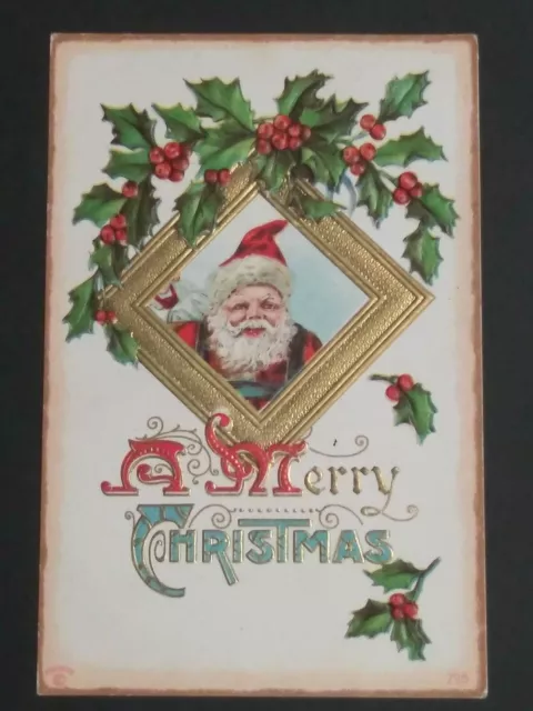 A Merry Christmas Santa Holly Gold Embossed P Sander Antique Postcard c1910s