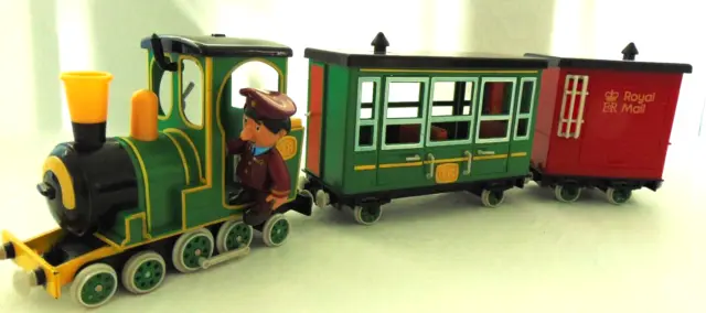 Postman Pat - Musical Greendale Rocket With 2 Carriages And Ajay Bains Figure