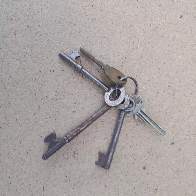 Bunch Of Five Vintage  Keys.  On Metal Loop.
