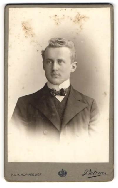 Photography C. Pietzner, Vienna, portrait of young man in suit with bow tie