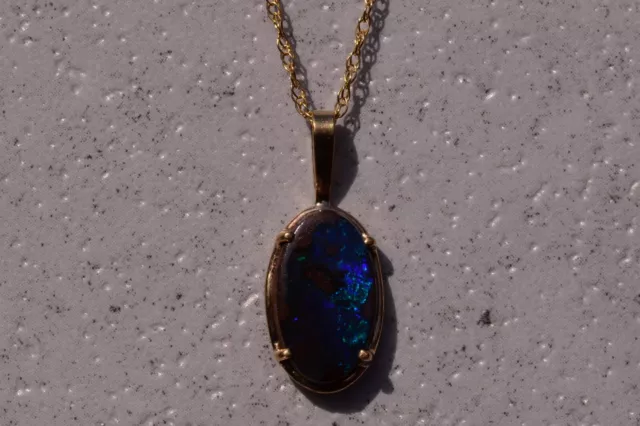 Natural Australian Boulder Opal in Framed Yellow Gold Pendant