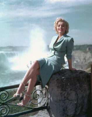 Marilyn Monroe Sitting On Rock by Ocean 8x10 Glossy Photo