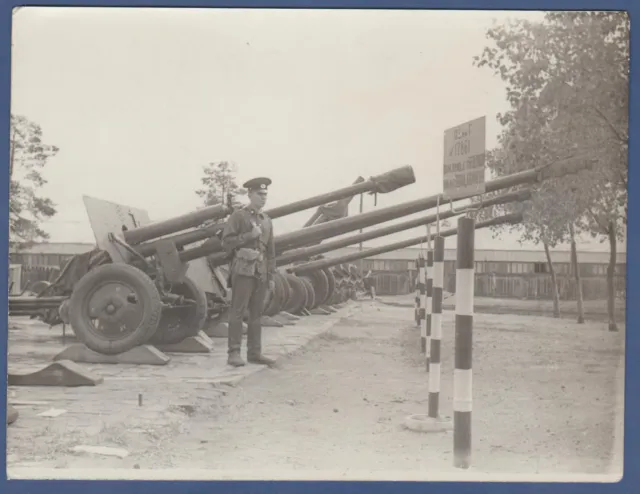 Handsome Military guy soldier with a gun near a garmat Soviet Vintage Photo USSR