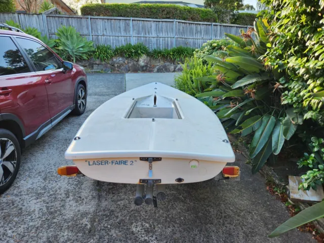 Laser sailing dinghy with road trailer