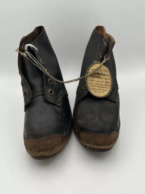 Pair Of Childs Wooden Clogs With Original Label.