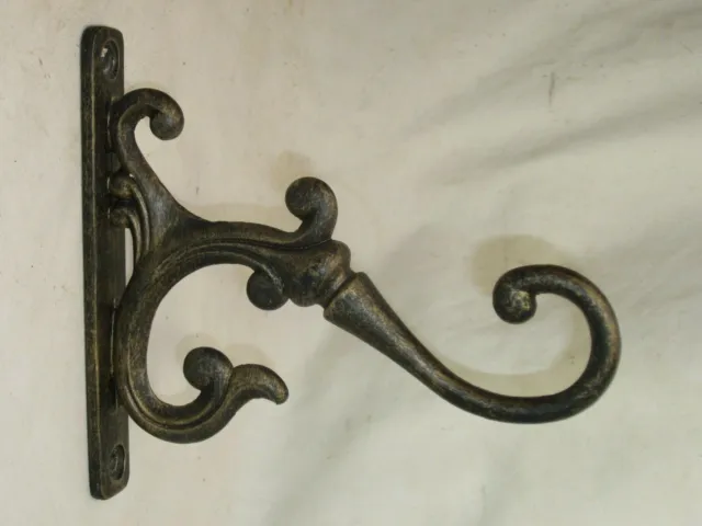 1 large ornate decorative metal hook approximately 6" x 5.5" wall mount hardware