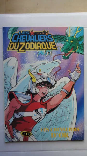 Les Chevaliers Du Zodiaque Les Chevaliers D'or Collection Album Tes Super Heros