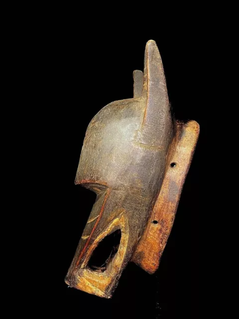 Maschera africana antica intagliata a mano in legno con decorazioni murali... 2