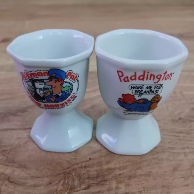 Vintage 1993 Postman Pat & 1991 Paddington Bear 2x White Ceramic Egg Cup Bundle