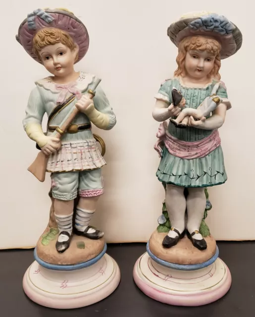 Pair of Early 20th Century German Bisque Young Boy and Girl Statuettes