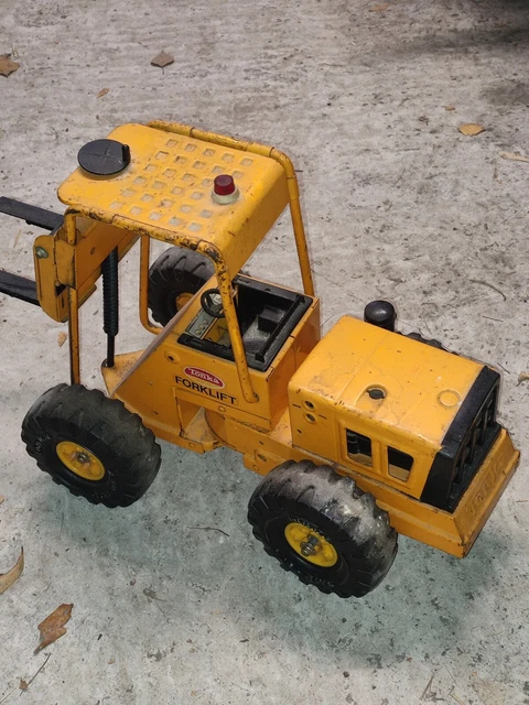 Camion de chantier à chariot-élévateur en tôle TONKA (années