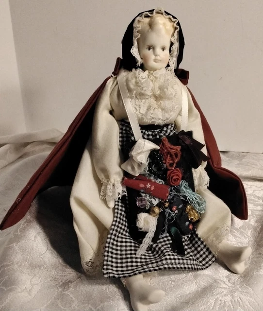 Vintage porcelain/bisque doll, cloth body, handmade apron