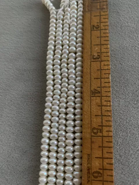 Fresh Water Pearls: White 5.5-5.9 mm button shape 5 strands 16"