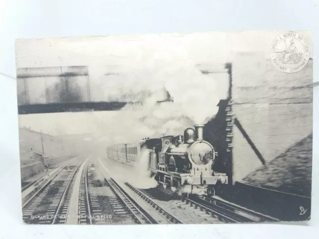 L&NW Railways Steam Locomotive Picking up Water at full Speed Antique Postcard
