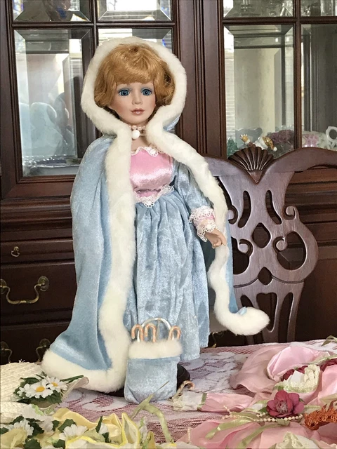 Heritage Signature Collection Four Season porcelain doll and 4 outfits w/ stand