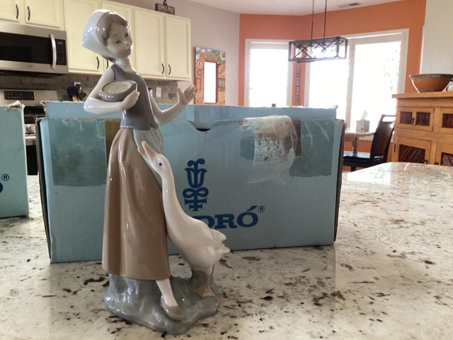 Lladro, “Corn for the Goose” figurine, 9 inches tall 