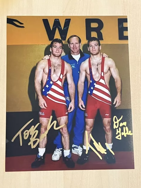 DAN GABLE & TERRY & TOM BRANDS SIGNED 8x10 PHOTO IOWA HAWKEYES WRESTLING COA DAN GABLE & TERRY & TOM BRANDS SIGNED 8x10 PHOTO IOWA HAWKEYES WRESTLING COA