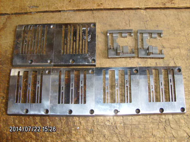 UNION SPECIAL 3-needle sewing machine lot (6) throat plates & (2) feed dogs