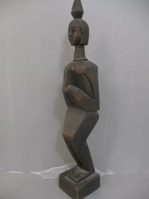Burmese art: Padaung, long neck woman figurine, a wooden hand carved sculpture,