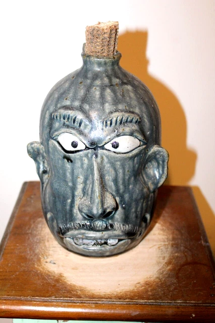 wayne hewell  face jug, pottery, folk art  10''x 7''