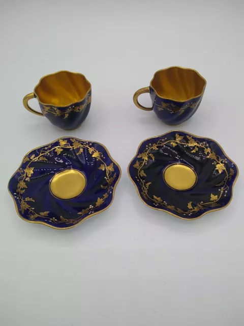 Pair of Coalport Cups and Saucers Demi Tasse Dark Blue Gilded & Jewelled grapes.