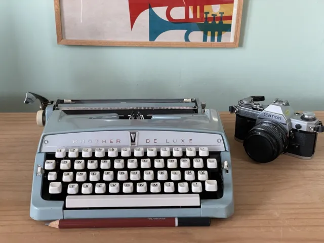 Brother de Luxe Typewriter,Schreibmaschine in light blue with a petrol case, 60s