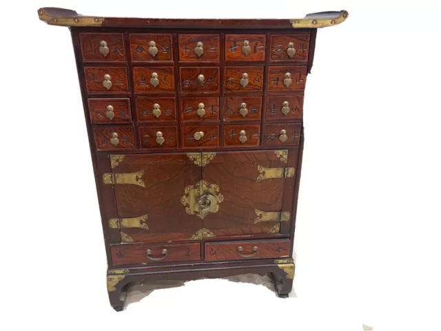 Chinese Elm Medicine Cabinet With An Arrangement Of Small Drawers Carved