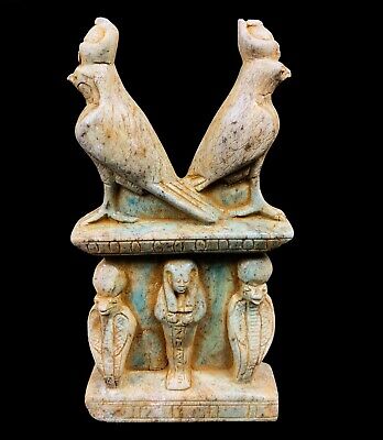 Beautiful statue of God Horus of the sky and the two cobras for protection