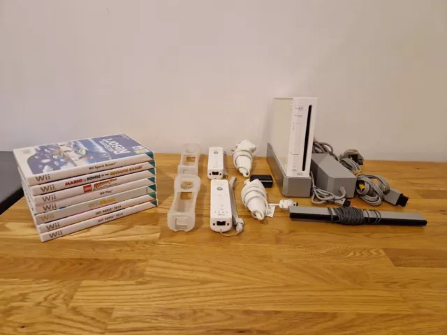 Large Nintendo Wii Console Bundle - 2 Controllers, 2 x Nun Chucks & 7 Games