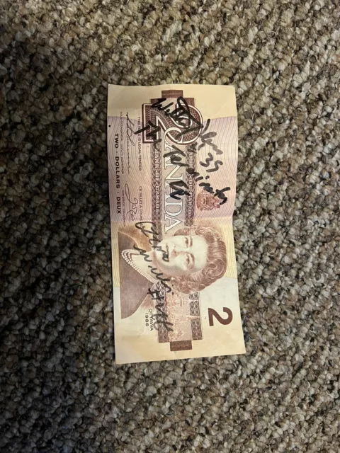 1986 canadian 2 dollar bill Signed By Willie Pless “The Terminator”.