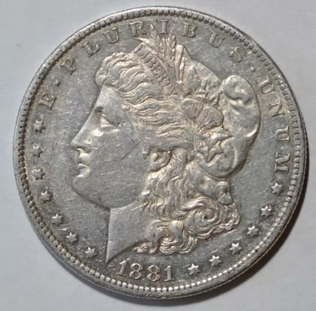 1881o Morgan silver dollar 90% silver in fine or better condition.