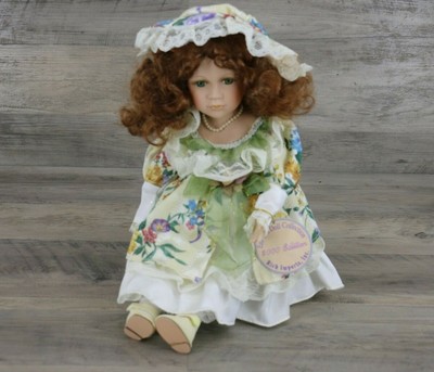 The Emerald Doll Collection Porcelain Doll In Floral Dress & Hat with Pearls