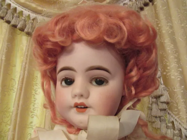 A Henri Rostal Mon Trésor bisque head musical pull-along doll, French circa  1914