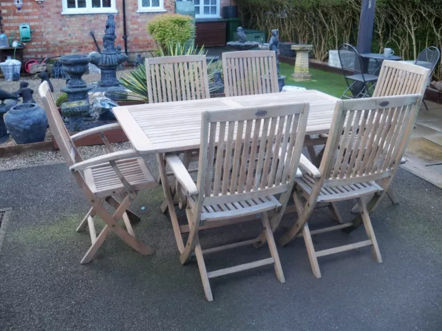 Large Teak garden table and 6 folding Teak chairs ( Hartman Brand)