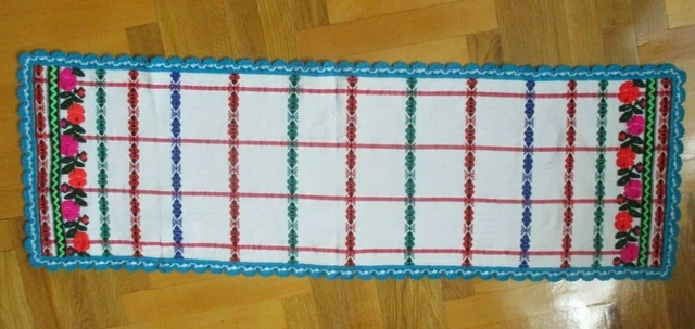 Homespun embroidered towel with lace.