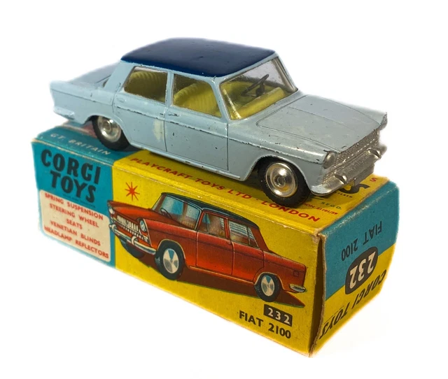 A Corgi Toys No. 217 Fiat 1800, finished in mustard yellow, and two No
