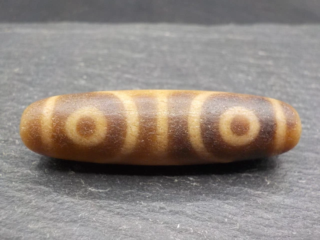 An Agate Dzi bead with a 4 Eye pattern from Tibet / Nepal.