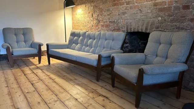 Mid-Century Danish dark wood stain sofa and armchair suite.