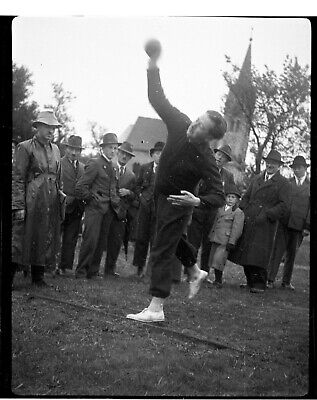 1940s Era Germany Photo Negative Gentleman Watching Man Shot Put White Shoes