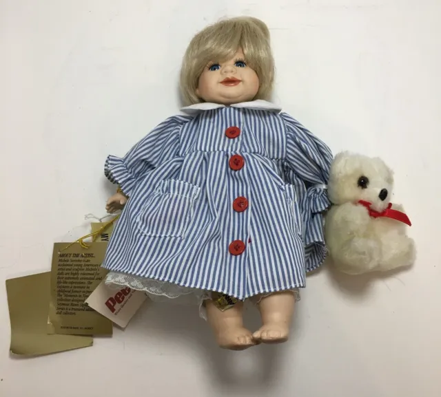 Signature Series Collection by Seymour Mann Porcelain Doll with Teddy Bear.