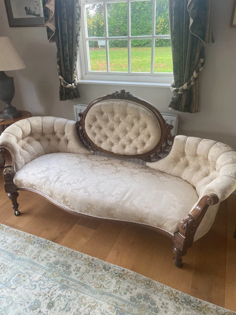 Antique Sofa: carved walnut and button upholstered settee, Victorian circa 1860
