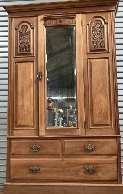 Antique carved walnut wardrobe with drawers