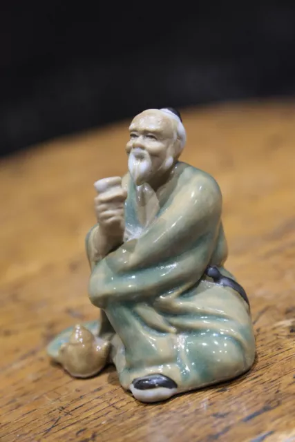 Vintage Shiwan chinese man sitting and drinking tea mudman figurine