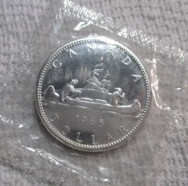 I'M SELLING 50+ CH-GEM BU/P-L CANADA SILVER DOLLARS-THESE 1965s IN MINT CELLO